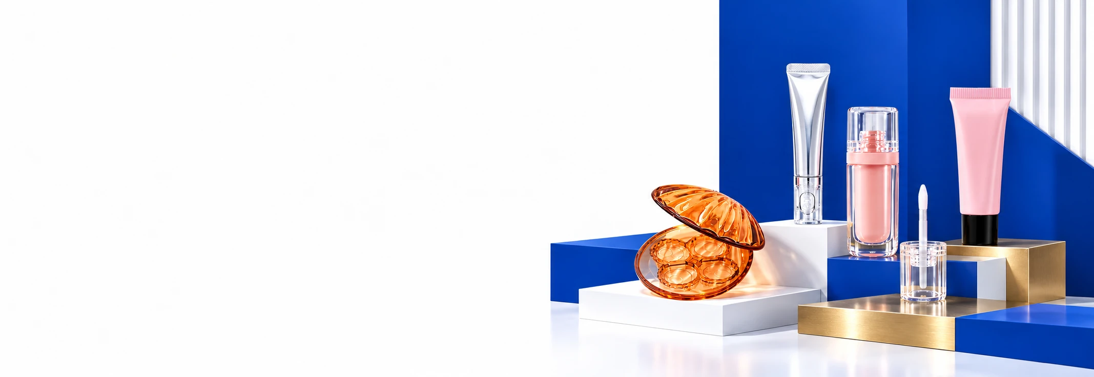 Cosmetic tubes, compacts and glass packaging arranged on a blue and white product stage